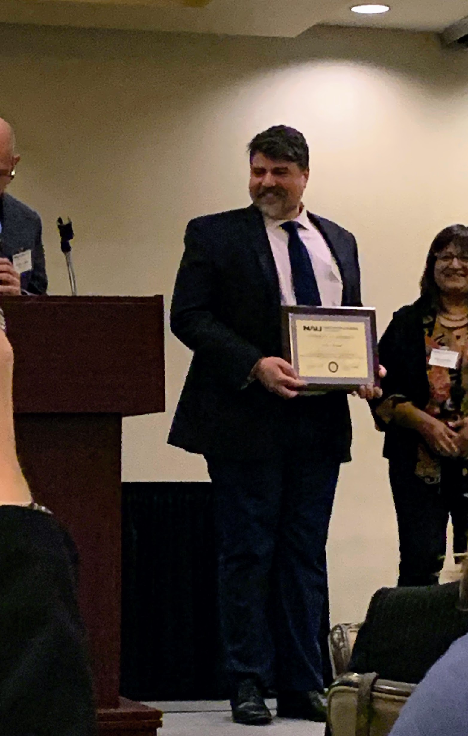 Andrew Horvath receiving the NAU College of Education Outstanding Master's Student recognition